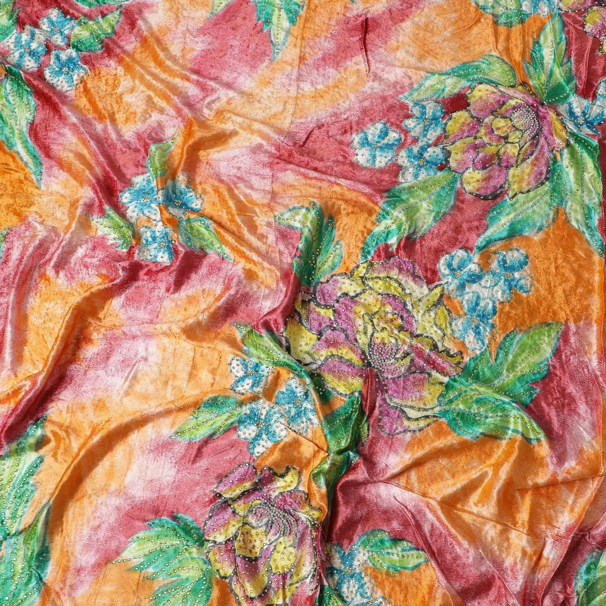 Cantaloupe orange and desire red Rayon velvet fabric with multicolor print and green stones in leaf design