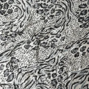 Daisy white Rayon velvet fabric with black, pewter grey print having metallic silver studs in abstract design