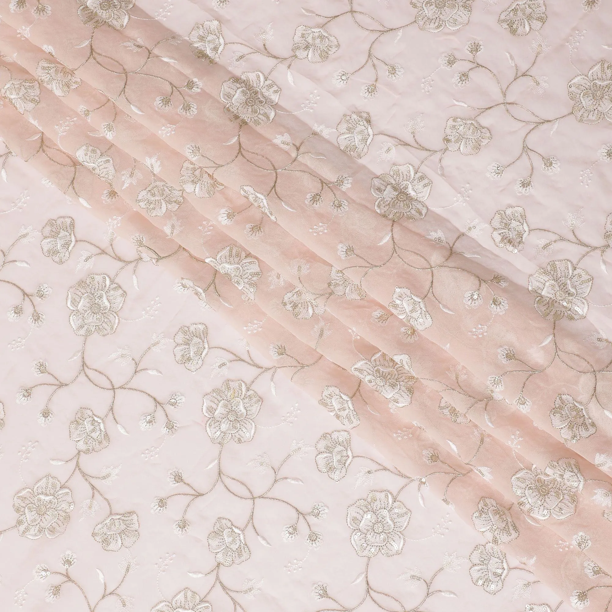 Light salmon peach synthetic georgette fabric with same tone and gold embroidery in floral design-D15821