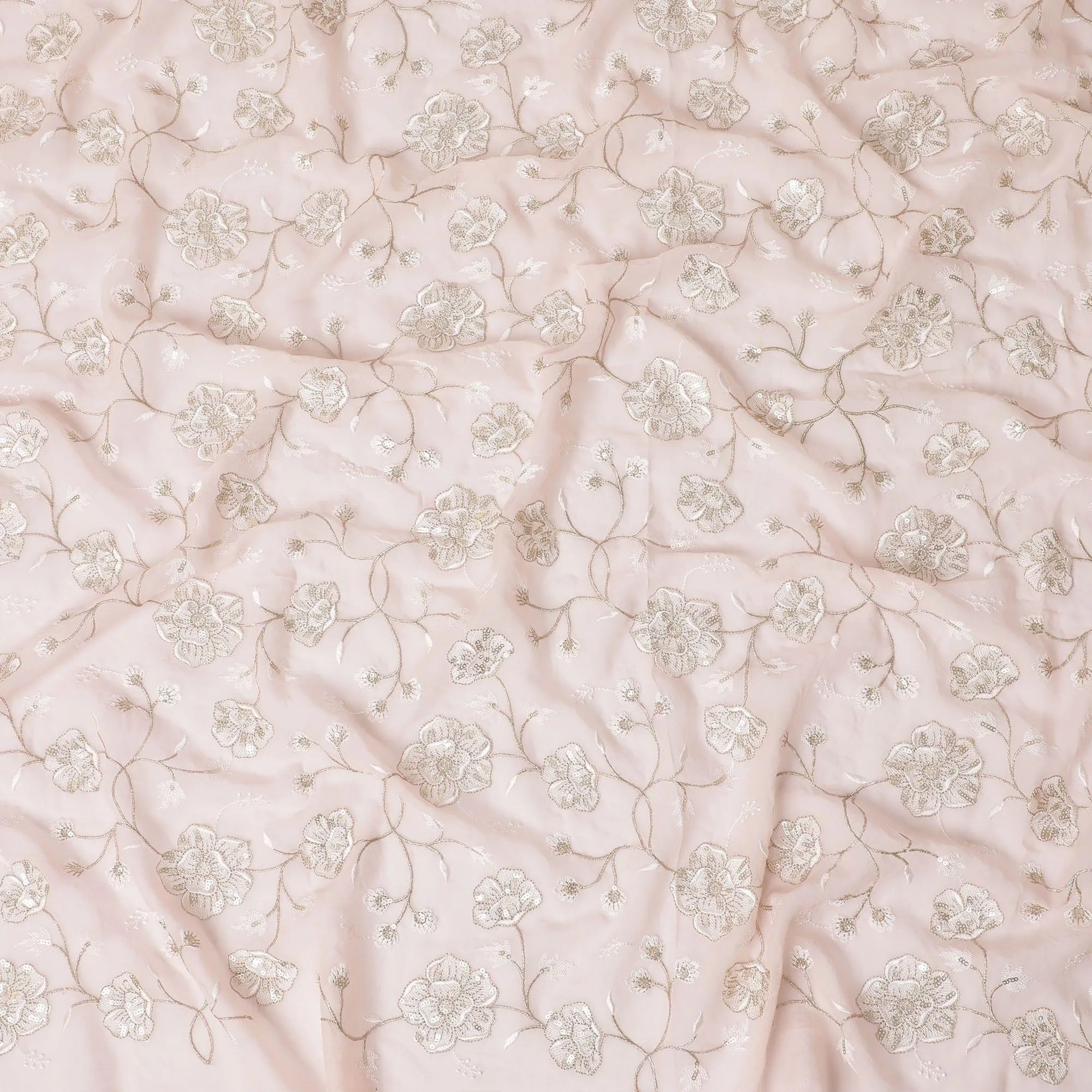 Light salmon peach synthetic georgette fabric with same tone and gold embroidery in floral design-D15821